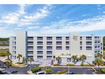 Spacious condos at Sands Beach Club feature multiple balconies and lush landscaping with palm trees at 9400 Shore Dr. # 206, Myrtle Beach, SC 29572