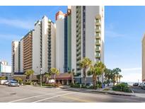 An attractive multi-story condo complex with well-manicured landscaping near a sandy beach at 2701 N Ocean Blvd. # 1260, Myrtle Beach, SC 29577