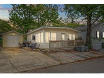 Charming beach home featuring a spacious wooden deck, convenient parking, and storage shed for all your beach necessities at 6001 - 1807 S Kings Hwy., Myrtle Beach, SC 29575