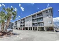 Coastal condo building with ample parking and elevated structure near the beach and ocean at 6001 N Ocean Blvd. # 342, North Myrtle Beach, SC 29582