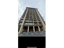 View of condo building showing parking and multiple floors of balconies at 7500 N Ocean Blvd. # 6120, Myrtle Beach, SC 29572