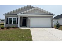 Charming single-Gathering home featuring a two-car garage and well-maintained lawn at 1029 Jase Dr., Longs, SC 29568