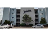 Xanadu condo building features a manicured landscape and reserved parking for residents at 1311 S Ocean Blvd. # B-1, North Myrtle Beach, SC 29582