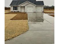 Charming single-Gathering home featuring a two-car garage and freshly laid lawn at 2247 Union Church Rd., Little River, SC 29566