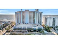 Beautiful exterior view of the beach front resort featuring a parking garage and well maintained landscape at 2311 S Ocean Blvd. # 430, Myrtle Beach, SC 29577