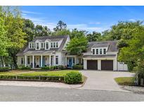 Charming two-story traditional home with a well manicured lawn and an attached two-car garage at 9340 Lake Dr., Myrtle Beach, SC 29572
