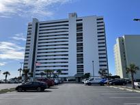 Beautiful beachfront condo building with a view of the parking lot and easy access to the beach at 9500 Shore Dr. # 17B, Myrtle Beach, SC 29572
