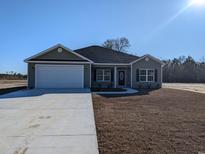 Charming single-story home with a two-car garage and freshly laid lawn at Tbd 80 Persimmon Rd., Aynor, SC 29511