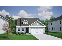 Charming single-story home with a two-car garage, lush lawn, and inviting curb appeal at 1109 Hainer Place Dr, Conway, SC 29526