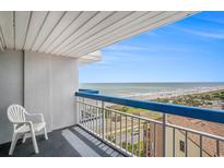 Spacious balcony with ocean view, white railing, and blue trim is the perfect place to relax at 5511 North Ocean Blvd. # 806, Myrtle Beach, SC 29577