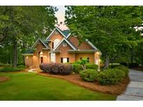 Brick home featuring manicured landscaping, healthy lawn, and a symmetrical facade offering great curb appeal at 79 Windsor Circle Sw, Ocean Isle Beach, NC 28469