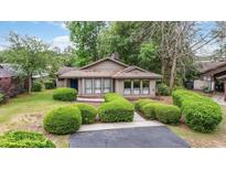 Charming single-story home featuring manicured shrubs and a well-maintained front yard at 931 Cedarwood Circle, Myrtle Beach, SC 29572