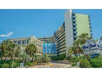 Attractive view of the Coral Beach Resort with its lush landscaping and blue accents at 1105 S Ocean Blvd. # 420, Myrtle Beach, SC 29577