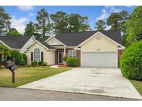 Charming single-story home features a well-maintained lawn, brick accents, and a two-car garage at 202 Glenwood Dr., Conway, SC 29526