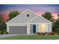 Charming single-Gathering home with a gray facade, blue door, attached garage, and well-manicured lawn at 279 River Edge Dr., Myrtle Beach, SC 29588