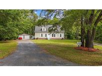 Charming single-Gathering home with an detached garage, and a well-manicured front lawn at 3565 Steamer Trace Rd., Conway, SC 29527