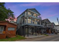 Three-story beach home with spacious balconies and ample parking underneath at 6001 - 1793 S Kings Hwy., Myrtle Beach, SC 29575