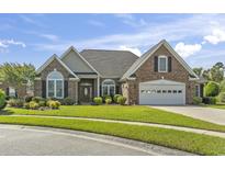 Charming single-story brick home with a well-manicured lawn, attached garage, and tasteful landscaping at 8204 Caddis Ct., Myrtle Beach, SC 29579