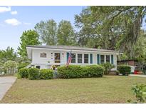 Charming single-story home featuring a well-manicured lawn and cute curb appeal at 908 Wood St., North Myrtle Beach, SC 29582