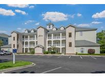Attractive condo building featuring multiple balconies and lush landscaping, perfect for a relaxed lifestyle at 1001 World Tour Blvd. # 203, Myrtle Beach, SC 29579