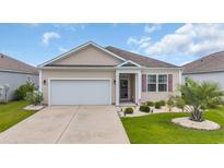Charming single-story home featuring a well-manicured lawn, attached garage, and neutral siding at 2757 Zenith Way, Myrtle Beach, SC 29577