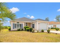 Charming single-story home with manicured lawn, attached garage, and welcoming curb appeal at 2951 Mary Hines Ln., Georgetown, SC 29440