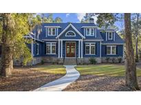 Charming blue two-story home with classic architectural details and a welcoming front entrance at 341 Brickwell Ln., Pawleys Island, SC 29585