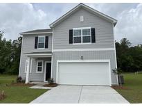 Charming two-story home with gray siding, black shutters, and a two-car garage at 635 Muster Field Ct., Conway, SC 29526