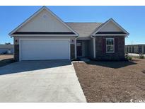 Charming single-story home with a two-car garage and well-maintained landscaping at 926 Padgett Lane, Conway, SC 29526
