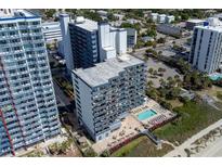 An aerial view of a multi-story condo building with pool and beach access at 2001 S Ocean Blvd. # 914, Myrtle Beach, SC 29577