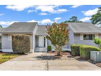 Charming home featuring a well-maintained yard and inviting entryway at 4339 Baldwin Ave. # 4339, Little River, SC 29566