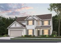Charming two-story home showcasing classic design, complemented by an attached two-car garage and manicured landscaping at 527 Oak Landing Dr., Myrtle Beach, SC 29588
