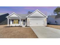 Charming single-story home with a two-car garage and well-maintained landscaping at 618 Lightwood Dr., Conway, SC 29526
