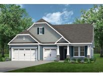 Charming home featuring a three-car garage, gray siding, stone accents, and well-manicured lawn at 711 St. Vincent Loop, Little River, SC 29566