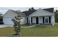 Charming single-story home featuring a well-maintained lawn and attached garage at 962 Willow Bend Dr., Myrtle Beach, SC 29579