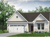 Charming single-story home with a two-car garage, complemented by lush greenery and manicured landscaping at 1208 Halter Pl., Calabash, NC 28467