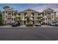 Inviting condo complex with private balconies, ample parking, and mature landscaping at 144 Puffin Dr. # 2A, Pawleys Island, SC 29585