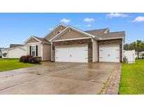 Beautiful home with a two car garage, stone accents, and well-maintained landscaping at 2317 Myerlee Dr., Myrtle Beach, SC 29588