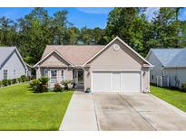 Charming single-story home with a well-maintained lawn and a two-car garage at 6478 Royal Pine Dr., Myrtle Beach, SC 29588