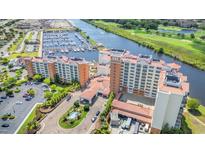 Stunning aerial view of waterfront resort, marina, and golf course, offering luxurious amenities and scenic surroundings at 8121 Amalfi Pl. # 7-604, Myrtle Beach, SC 29572