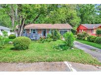 Charming single-story home with a well-maintained lawn and mature trees providing shade and curb appeal at 1104 Ragin St., Myrtle Beach, SC 29577
