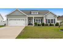 Charming single story home with a manicured lawn, a two car garage, and lovely curb appeal at 322 Canyon Dr., Conway, SC 29526