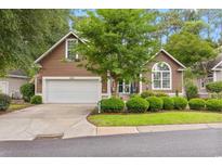 Charming single-Gathering home featuring a two-car garage and a well-maintained lawn at 4803 Bucks Bluff Dr., North Myrtle Beach, SC 29582