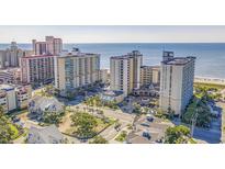 Beautiful aerial view of a beachfront hotel property with ocean views and palm trees at 5300 N Ocean Blvd. N # 1120, Myrtle Beach, SC 29577