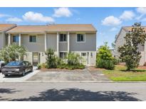 Charming townhome with well-maintained landscaping and a private driveway at 951 Plantation Dr. # F8, Little River, SC 29566
