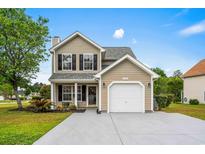Charming two-story home boasts manicured lawn and attached one car garage at 101 Barclay Dr., Myrtle Beach, SC 29579