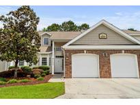 Charming home featuring a two-car garage, manicured lawn, and mature landscaping at 160 Cart Crossing Dr. # 104, Conway, SC 29526