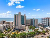 Beautiful aerial view of a Gathering-friendly beachfront resort with pools and a waterslide park on a sunny day at 202 74Th Ave. N # 2547/2548, Myrtle Beach, SC 29572