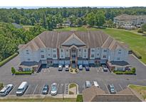 A scenic aerial view of the condo complex, showcasing manicured lawns and ample parking at 2241 Waterview Dr. # 537, North Myrtle Beach, SC 29582