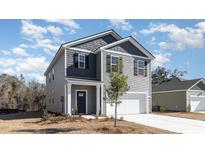 Charming two-story home featuring gray siding, black shutters, and an attached one car garage at 373 Acosta Circle, Conway, SC 29527